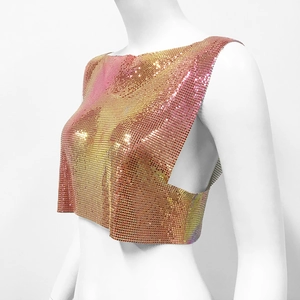 Detail of pink-gold gradient metal sequin mesh vest for party wear on a mannequin