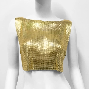 Close-up of golden metallic sequin crop top with chainmail texture and shiny finish
