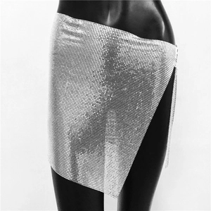 Detail shot of shimmering silver metal sequin wrap mini skirt on a black mannequin