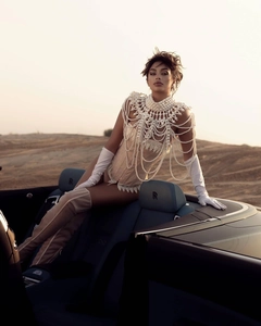 Detailed view of multilayer pearl body chain shawl with fringes in retro court style