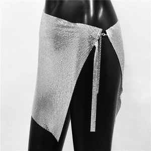 Detailed macro view of silver metallic sequin mesh mini skirt with adjustable chain