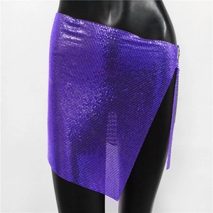 Detailed macro view of purple metallic sequins and high slit design on party mini skirt