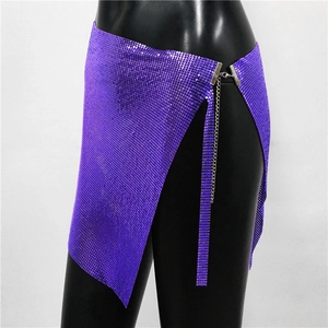 Detail of purple metallic sequin mini skirt featuring mesh texture and side chain buckle