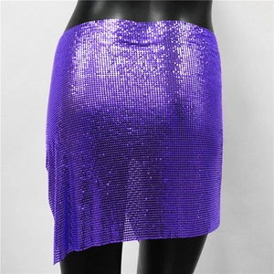 Macro detail of purple metallic sequin mesh fabric on an asymmetrical mini skirt