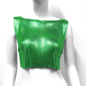 Detail of emerald green sequin crop top featuring metallic mesh texture and straight neckline