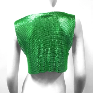 Detail view of the back of a vibrant green metallic mesh sequin crop top on mannequin