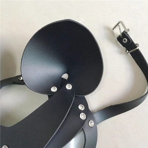Close-up of black PU leather mask with animal ears, silver rivets and adjustable buckle