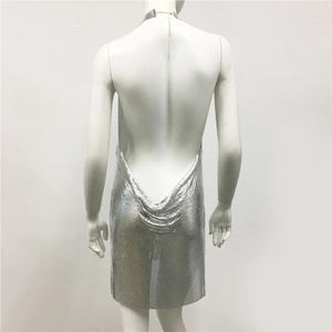 Detail of metallic silver sequin mesh on a halter backless dress for parties