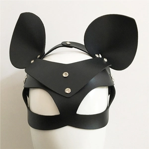 Detail of black leather animal mask with silver rhinestones and large round ears