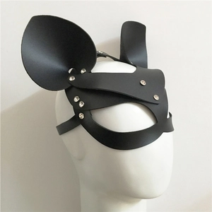 Detail view of black faux leather cat mask with rhinestone edges on white mannequin head