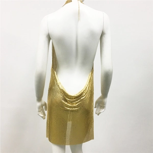 Detail view of the back of a gold metallic mesh halter dress with backless drape design