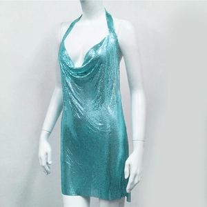 Detailed close-up of teal metallic sequin mesh fabric on a sexy halter party dress