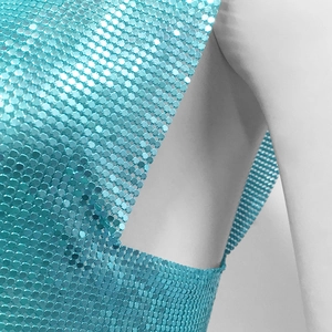 Detail of light blue metal mesh sequins fabric with high-reflectivity for clubwear tops