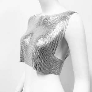 Close-up of silver metal mesh crop top showing detailed sequin texture and shimmer