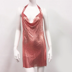 Macro detail of rose gold metal mesh texture and cowl neck drape on a mini party dress