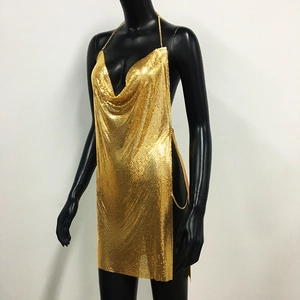 Detailed close-up of golden metallic mesh fabric on a sexy side slit party dress