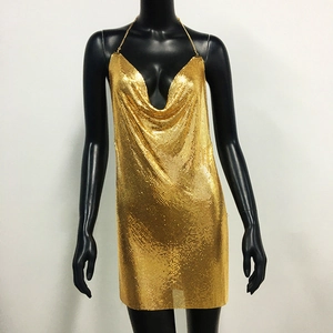 Detail view of shimmering gold chainmail mesh fabric on a sexy party mini dress