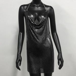 Detail of silver chainmail party dress featuring a cowl neck and deep V-neckline