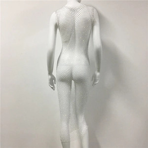 Detailed back view of white rhinestone mesh dress showing sheer fabric and sparkling crystals