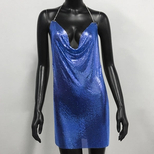 Detailed macro view of the shiny blue chainmail metal sequins on the cowl neck halter dress