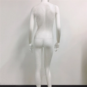 Detailed back view of white fishnet maxi dress with sparkling rhinestones on mesh fabric