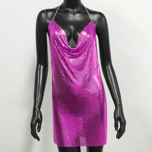 Detail of fuchsia chainmail fabric with metallic reflection on a party dress
