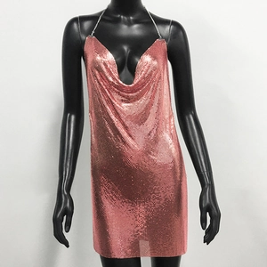Close-up of rose gold metallic sequin mesh fabric on sexy high-slit party dress