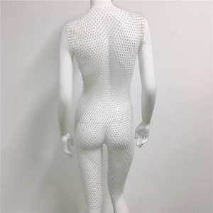 Detail of white mesh fishnet dress with high-density rhinestones shown from the back view