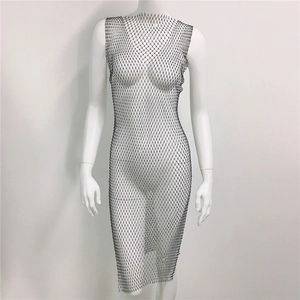 Detail of black mesh dress featuring sparkling rhinestones and delicate fishnet texture