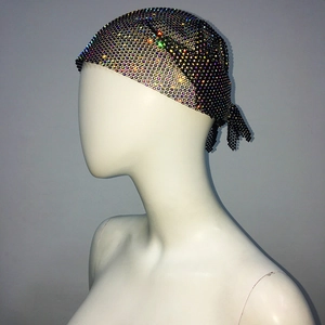 Detail of black mesh bandana top with multi-color rhinestones and knotting design