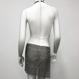 Detail of sequin metal mesh backless top and skirt set with adjustable chains