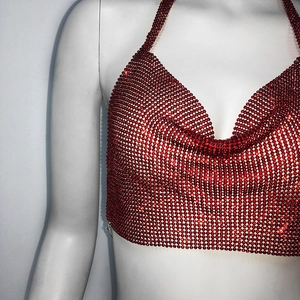 Close-up of a sexy red rhinestone halter crop top with shiny metal mesh and beads