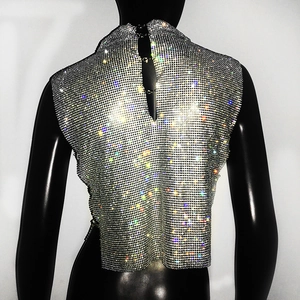 Detail view of silver rhinestone mesh halter top with sparkling crystal grid texture