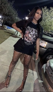 Detail view of sparkling rhinestone mesh pants and tiger print graphic tee outfit