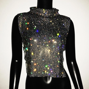 Macro view of mesh halter top with colorful rhinestones on a black mannequin bust