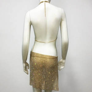 Macro view of gold rhinestone mesh mini skirt with delicate chain waist details
