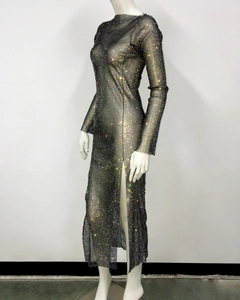 Detail of black fishnet dress with sparkling rhinestones and side slit detail