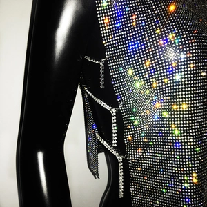 Detail of silver rhinestone halter top with side hollow-out and sparkling crystal chains