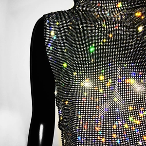 Close-up of sparkling colorful rhinestones on a luxury high-neck sleeveless mesh top