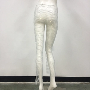 Detailed close-up showing the white mesh fabric and sparkling rhinestones on the trousers