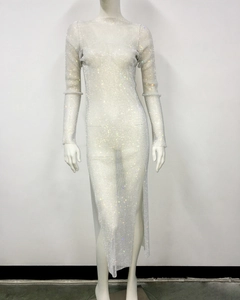Detail of rhinestone mesh dress featuring side slit and sparkling crystal embellishments