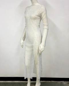 Detail of white mesh dress with shimmering rhinestones and a high side slit design