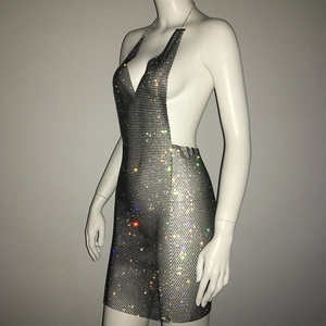 Detail of silver rhinestone mesh dress with halter neck and shimmering metallic crystals
