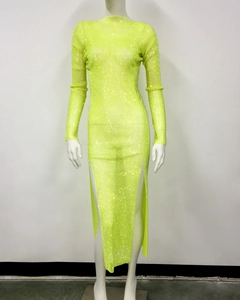 Detail of neon green mesh maxi dress with sparkling rhinestones and high side slits