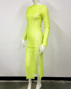 Detail of neon green fishnet dress with sparkling rhinestones and a high side slit