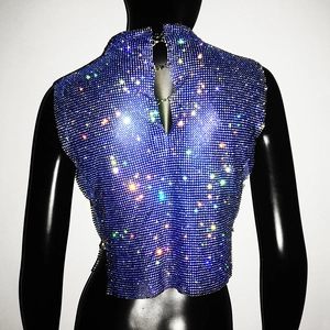 Macro detail of high collar blue rhinestone mesh vest with back cutout and chain closure