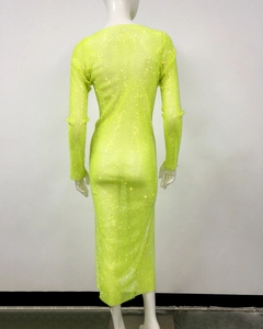 Detailed back view of a neon green rhinestone fishnet dress with sheer mesh texture