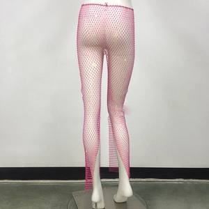 Close-up of pink rhinestone fishnet pants featuring glittering crystals on mesh fabric