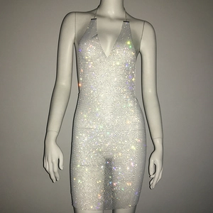 Detailed view of shimmering rhinestone mesh and plunging V-neck on the party mini dress