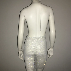 Detail of sheer mesh dress with high-density rhinestones and silver metal back chain